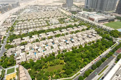 an aerial view of a large apartment complex at Modern Living with Skyline Views in Hartland in Dubai
