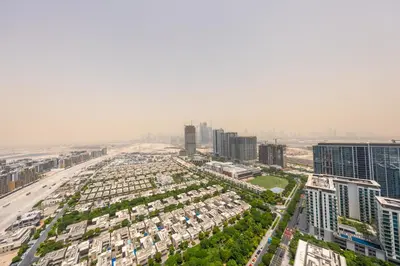 an aerial view of a city with tall buildings at Modern Living with Skyline Views in Hartland in Dubai