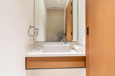 a bathroom with a sink and a mirror at High Rise Apartment with Direct Access to Marina Walk, Near JBR, Marina Mall and Dubai Dining Hotspots, VIDA Residences, Dubai Marina by Deluxe Holiday Homes in Dubai