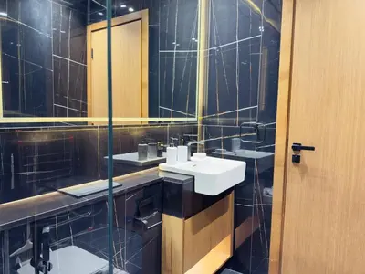 a bathroom with two sinks and a mirror at Private Pool II Spacious II Brand New in Dubai