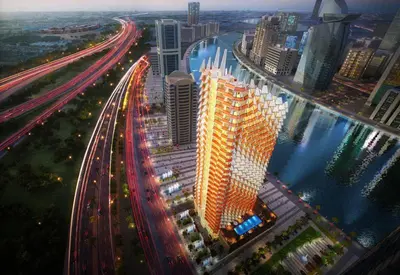 a large building with lights on in a city at Stylish Furnished Apartment with Burj Khalifa View, High Floor in Dubai