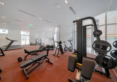 a gym with a bunch of exercise bikes in it at Stylish Furnished Apartment with Burj Khalifa View, High Floor in Dubai