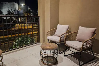 two chairs and a table on a balcony at Luxurious Apartment in the Heart of Dubai in Dubai