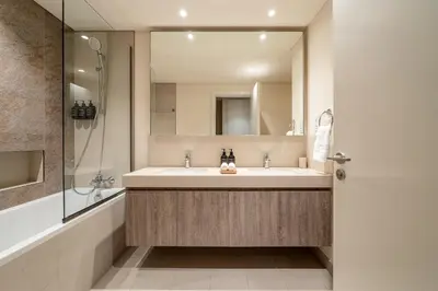 a bathroom with a sink and a mirror at Seraya Residence 19 - 4BDR - 180 Burj View & DIFC views in Dubai