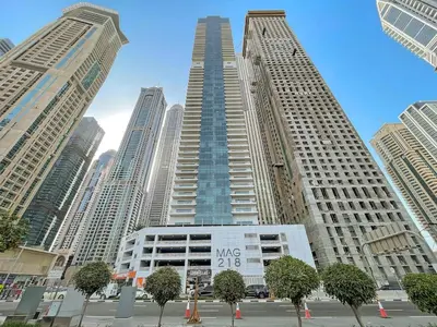 a tall building in a city with many tall buildings at 2BR Dubai City Skyline View Near Marina Walk Dining Shops & JBR in Dubai