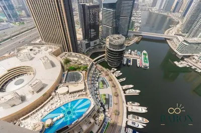an aerial view of a marina with boats in the water at The Cozy in Dubai