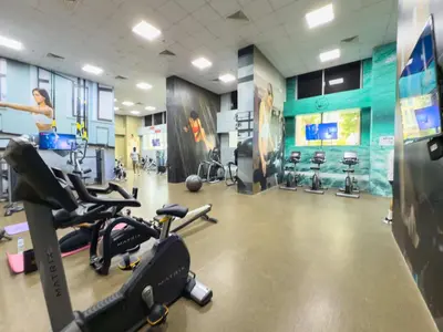 a gym with several treadmills and exercise bikes at 2BR Waterfront Apartment Nr Downtown in Dubai