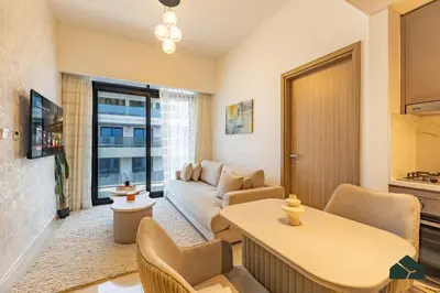a living room with a couch and a table at Peaceful 2BR with Community Views by BMS in Dubai