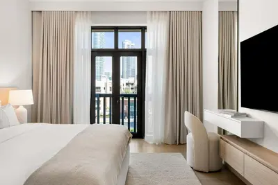 a hotel room with a bed and a television at DAYF-ROD Luxurious 2 Bed Apartment in Souk Al Bahar in Dubai