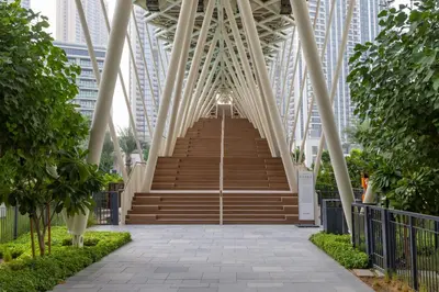 a bridge in the middle of a city at Maison Privee - Creekside Elegance with Canal Vws at Creek Beach in Dubai