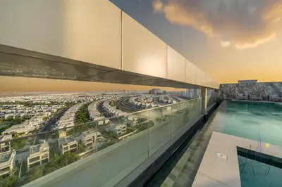 a rendering of the rooftop of a building with a swimming pool at Grove Luxurious Stu Best community Art & Design in Dubai