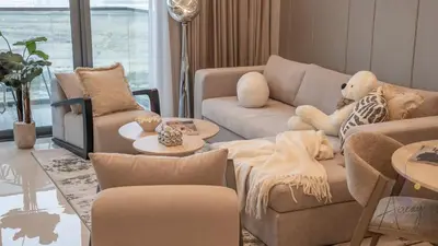 a living room with two couches and a table at Luxe Haven 1BR8min drive DubaiMall & BurjKhalifa in Dubai