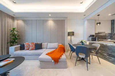a living room with a couch and a table at Luxury Comfort 1BRNear Dubai Mall & Burj Khalifa in Dubai