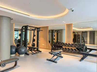 a gym with a lot of exercise equipment at Luxurious Design Boutique Studio Hideaway JVC in Dubai