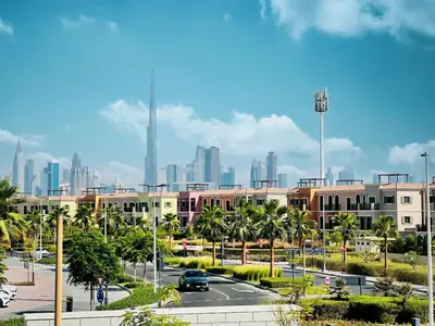 a parking lot with a city skyline in the background at Stylish Apartment - Private Beach - Port de La Mer in Dubai