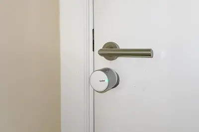 ajar door with a metal handle on a white door at Jumeirah Beach Residences Private Beach & Sea View in Dubai