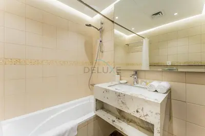 a bathroom with a sink and a shower at Short Walk to Marina Mall, Marina Walk and JBR Beach, Stunning Marina Views - Bay Central 2, Dubai Marina by Deluxe Holiday Homes in Dubai