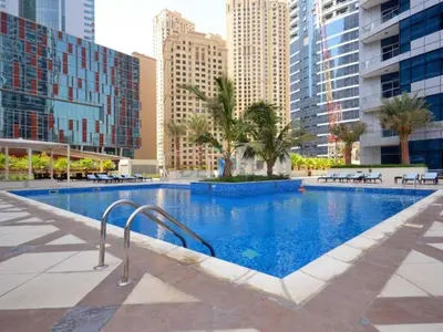 a swimming pool in a city with tall buildings at Short Walk to Marina Mall, Marina Walk and JBR Beach, Stunning Marina Views - Bay Central 2, Dubai Marina by Deluxe Holiday Homes in Dubai