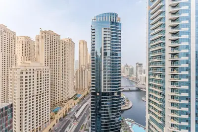 a view of a city with tall buildings and a river at Short Walk to Marina Mall, Marina Walk and JBR Beach, Stunning Marina Views - Bay Central 2, Dubai Marina by Deluxe Holiday Homes in Dubai