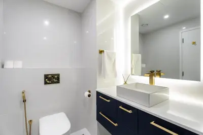 a bathroom with a sink and a mirror at High-End Designer Stay l 4 Bed + Maids Room l JBR in Dubai