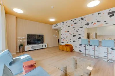 a room with a rock wall with a climbing wall at Marina Tower Residences by Baytna in Dubai