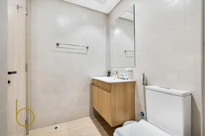 a bathroom with a toilet and a sink and a shower at Bookable - Alexis Tower, Studio Room with Balcony in Dubai