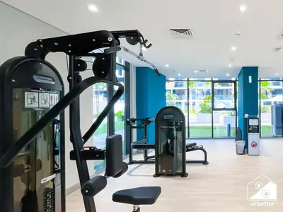 a gym with cardio equipment in a building at Serenity Studio with Balcony at Azizi Riviera in Dubai