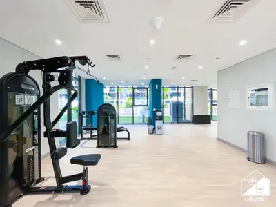 a gym with cardio equipment in a building at Serenity Studio with Balcony at Azizi Riviera in Dubai