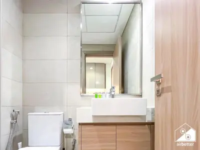 a bathroom with a white sink and a mirror at Modern Comfort Studio Relax & Unwind in Style in Dubai