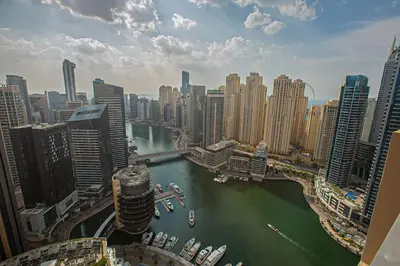 a view of a city with a river and buildings at Luxury in Dubai Marina Dining Pool Day & Beaches in Dubai