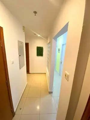a hallway of a building with a hallwayngthngthngthngthngthngthngthngth at Excellent Partition Room In Barsha Heights Tecom in Dubai