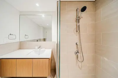 a bathroom with a sink and a shower at Spacious 3BD apartment at Creek Beach, Dubai in Dubai