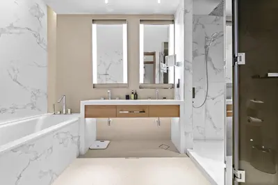 a bathroom with a tub and a sink and a mirror at VayK - Exceptional 2BR at Address Dubai Opera in Dubai
