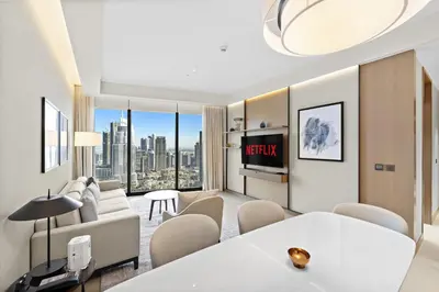 a living room with a view of a city at VayK - Exceptional 2BR at Address Dubai Opera in Dubai