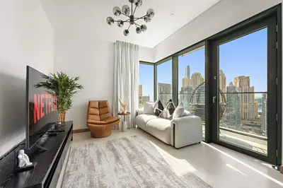 a living room with a tub and large windows at VayK - Luxury 1BR with Marina View in Dubai