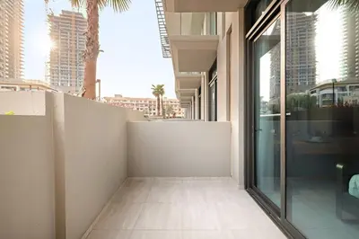 a hallway in a building with a view of a city at Stylish studio Near Downtown Dubai with Pool & Gym Access in Dubai
