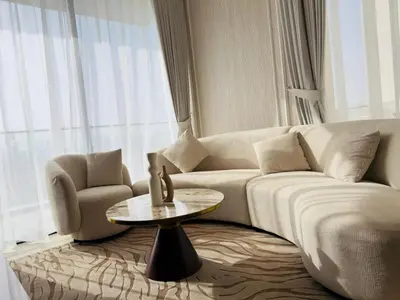 a living room with a couch and a table at Brand New with Installed Private Pool in Balcony in Dubai