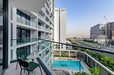 a balcony of a building with a swimming pool at Modern Studio at Paragon with City View in Dubai