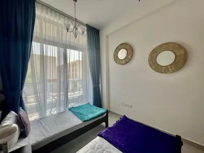 a room with a window with a bed at Al Karama close to subway in Dubai
