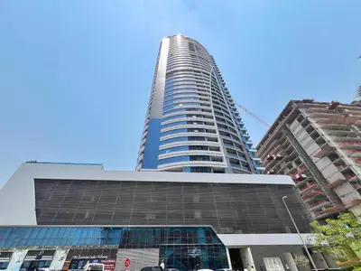 a tall building in the middle of a city at Modern Studio with Stunning City Views in Dubai