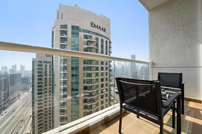 a balcony with a view of a tall building at Spacious Studio - 10 min drive to Burj Khalifa in Dubai
