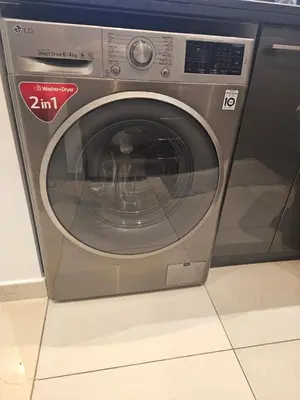 a silver washing machine sitting in a room at Dubai Silverene Tower with large balcony and high floor Marina views in Dubai