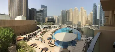 a view of a pool in a city with buildings at Amazing Dubai Marina Studio Pool Beach Sea View in Dubai