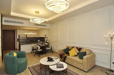 a living room with a couch and chairs and a table at Luxury 1 Bedroom Burj Khalifa View Citywalk in Dubai