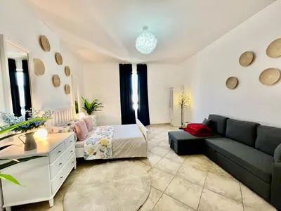 a living room with a couch and a table at Motor City Shakespeare Circus in Dubai