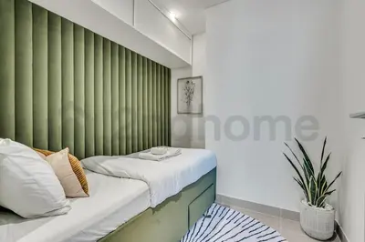 a bedroom with green vertical blinds and a bed at Burj Khalifa view, 3 Bedroom, Maids Room, Forte in Dubai