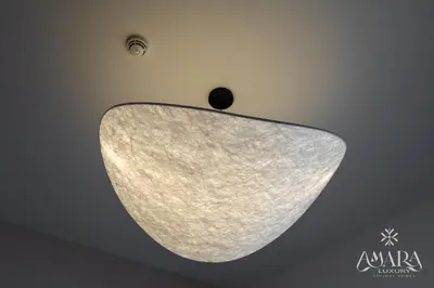 a light fixture on the ceiling of a room at Grande Luxury, Burj Khalifa & Fountain View in Dubai