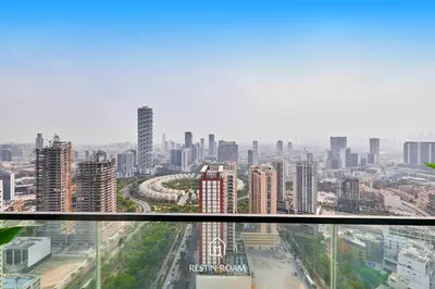 a view of a city from a skyscraper at Luxury 1B - CityView Near Parks and Mall JVC in Dubai