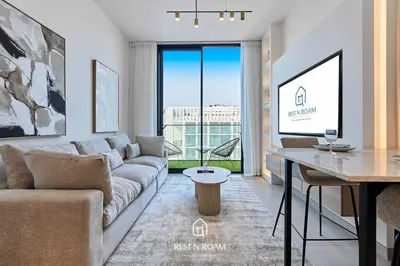 a living room with a couch and a table at Binghatti Gardenia 1BR - Near Parks and Mall JVC in Dubai
