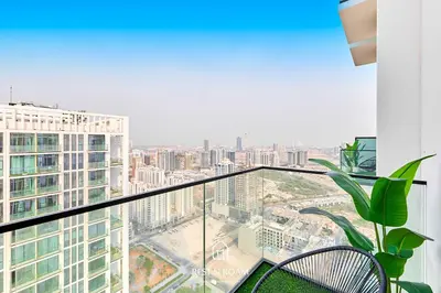 a balcony with a view of a city at Binghatti Gardenia 1BR - Near Parks and Mall JVC in Dubai